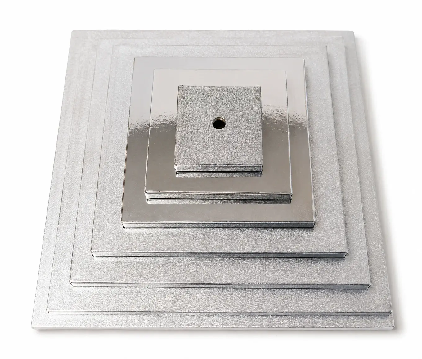 Square silver foil cake cards in graduated sizes, stacked to show the range, each with the centre hole pre-cut